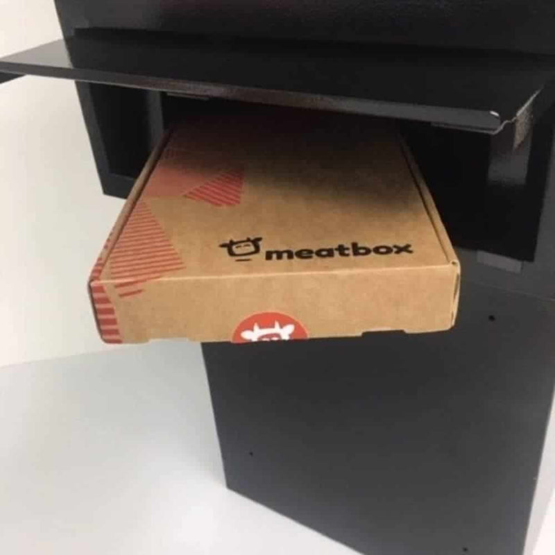Image showing a Meatbox gift box being posted in a Sigma parcel box