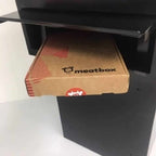 Image showing a Meatbox gift box being posted in a Sigma parcel box