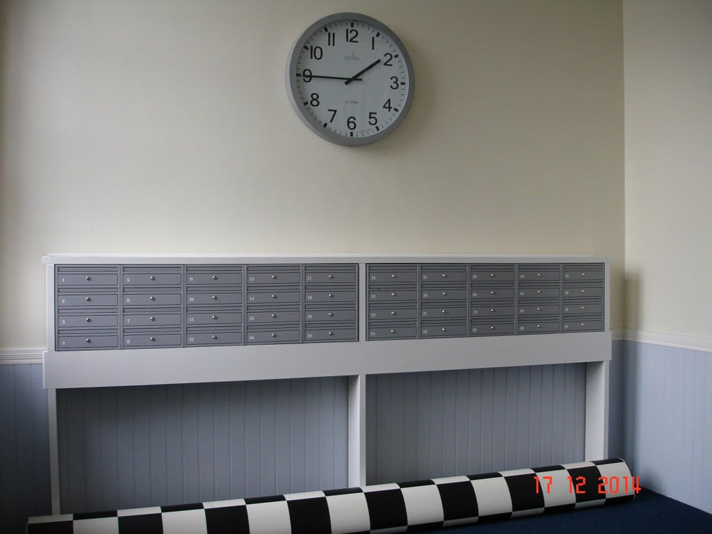 Wall mounted E1 commercial post boxes mounted on the stand